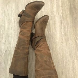 Knee high “Rockie” brown leather boots.